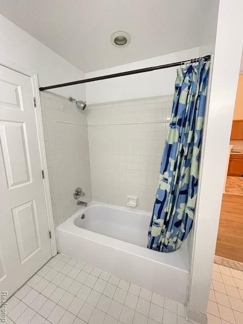 30885 Lee Frank Ln, Madison Heights, MI 48071 - bathroom featuring tile patterned floors and shower / bath combo with shower curtain