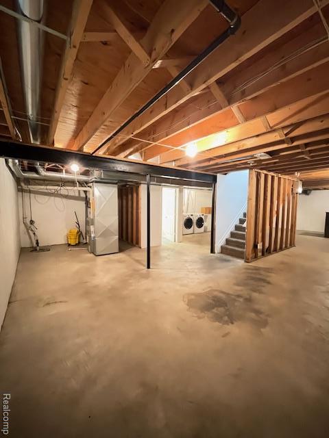 30885 Lee Frank Ln, Madison Heights, MI 48071 - unfinished below grade area with independent washer and dryer, stairway, and heating unit