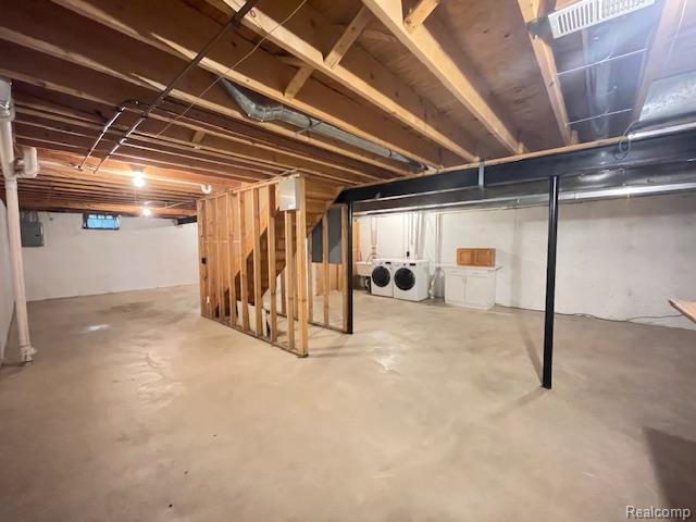 30885 Lee Frank Ln, Madison Heights, MI 48071 - unfinished below grade area featuring washer and clothes dryer and stairs