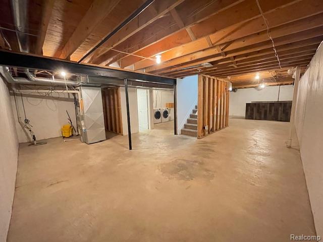 30885 Lee Frank Ln, Madison Heights, MI 48071 - unfinished below grade area with independent washer and dryer, stairs, and heating unit