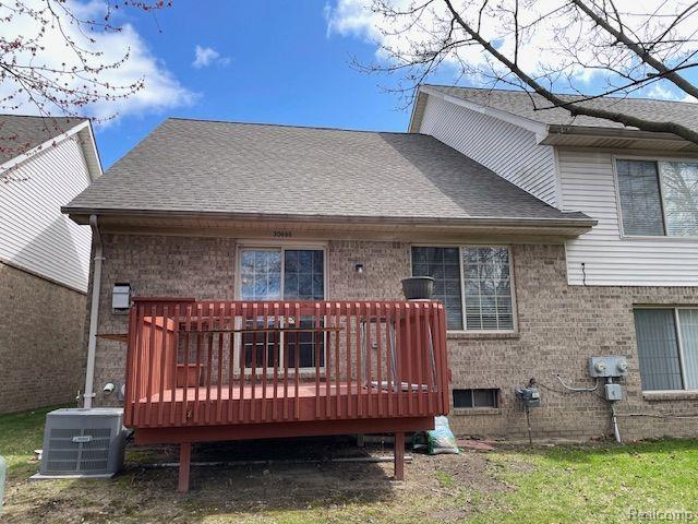 30885 Lee Frank Ln, Madison Heights, MI 48071 - rear view of property featuring brick siding, a shingled roof, and a deck