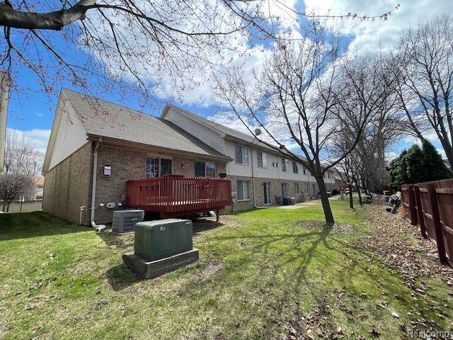 30885 Lee Frank Ln, Madison Heights, MI 48071 - back of property featuring a deck and brick siding