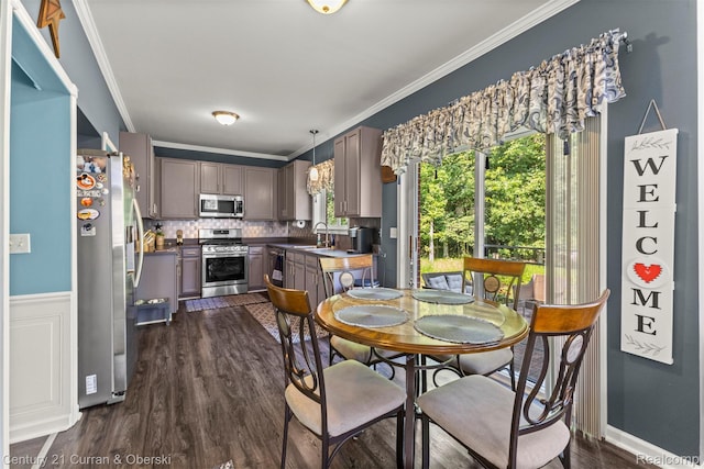 29520 Hunter St, Trenton, MI 48183 - dining space featuring crown molding and dark wood-style flooring