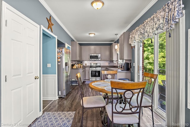 29520 Hunter St, Trenton, MI 48183 - dining area with crown molding, dark wood-style flooring, and a wainscoted wall