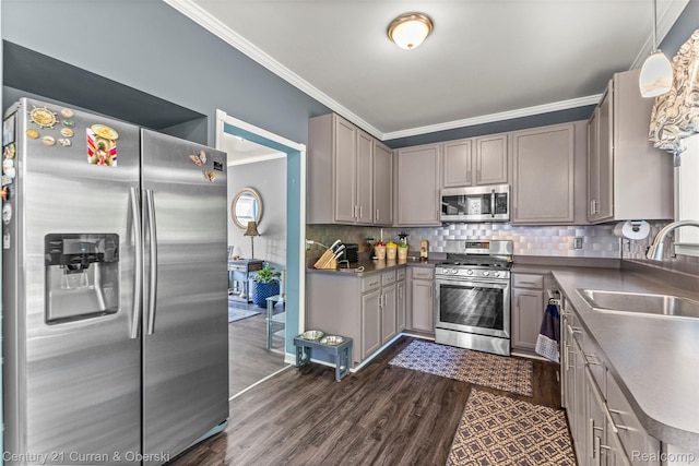 29520 Hunter St, Trenton, MI 48183 - kitchen with stainless steel appliances, crown molding, gray cabinetry, dark wood finished floors, and tasteful backsplash