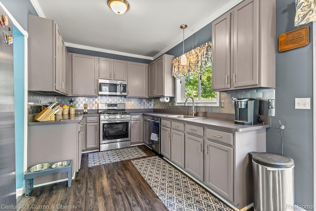 29520 Hunter St, Trenton, MI 48183 - kitchen featuring stainless steel appliances, gray cabinets, dark wood-type flooring, crown molding, and decorative backsplash