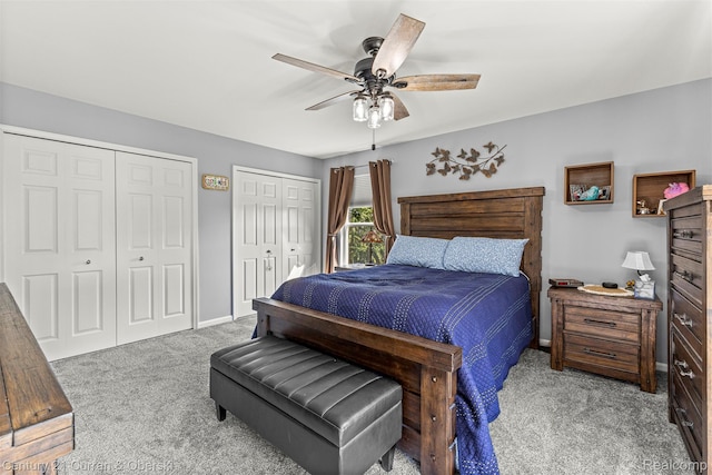 29520 Hunter St, Trenton, MI 48183 - carpeted bedroom featuring two closets and a ceiling fan