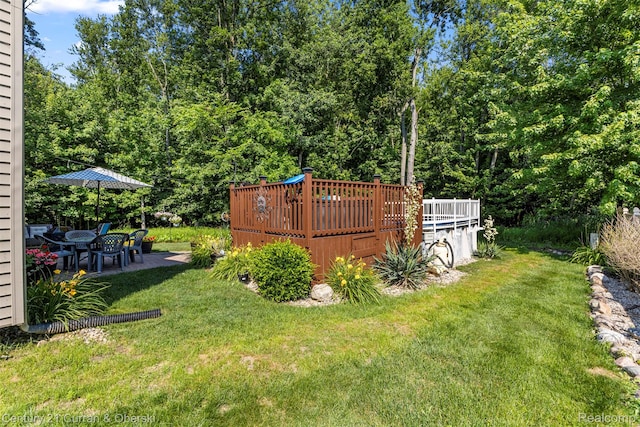 29520 Hunter St, Trenton, MI 48183 - view of green lawn featuring a wooden deck and a patio area