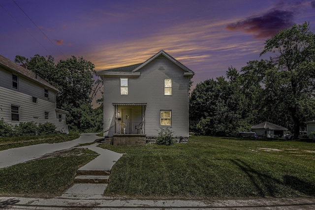 1211 S Jackson St, Jackson, MI 49203 - traditional-style house with a lawn