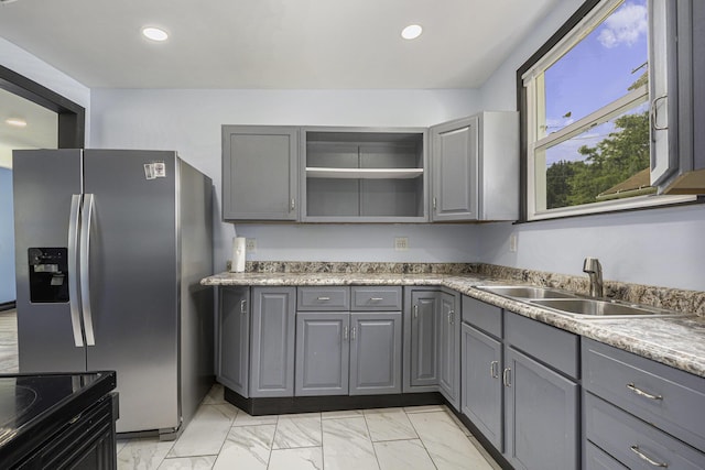 1211 S Jackson St, Jackson, MI 49203 - kitchen featuring gray cabinetry, stainless steel refrigerator with ice dispenser, light marble finish floors, and recessed lighting