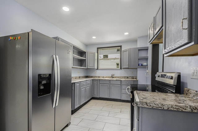 1211 S Jackson St, Jackson, MI 49203 - kitchen featuring stainless steel appliances, open shelves, gray cabinets, light marble finish floors, and recessed lighting