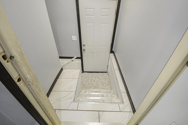 1211 S Jackson St, Jackson, MI 49203 - staircase with baseboards