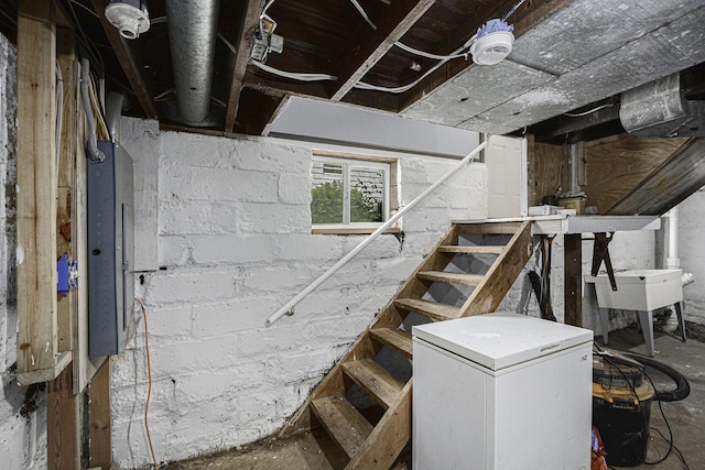 1211 S Jackson St, Jackson, MI 49203 - below grade area with fridge