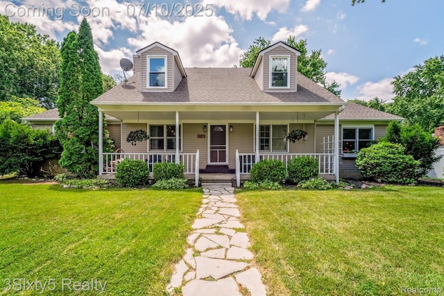 4375 Island Park Dr, Waterford, MI 48329 - cape cod-style house featuring a front lawn, covered porch, and a shingled roof