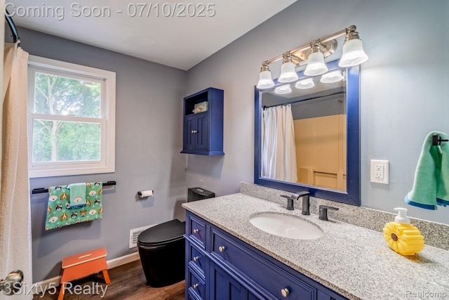 4375 Island Park Dr, Waterford, MI 48329 - full bathroom with vanity, wood finished floors, and curtained shower