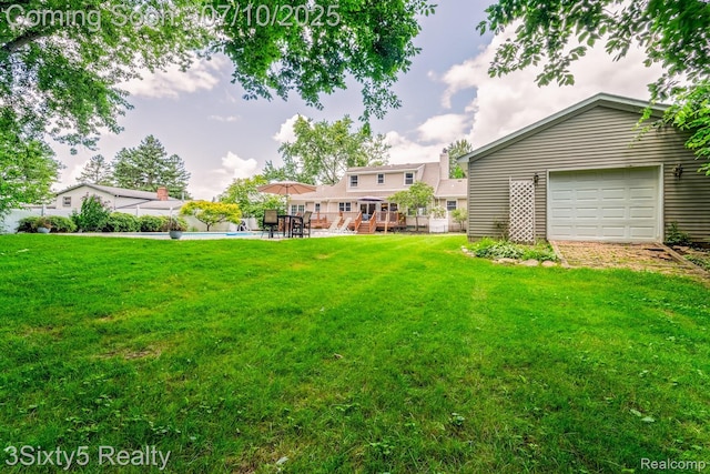 4375 Island Park Dr, Waterford, MI 48329 - view of green lawn with a garage and a deck