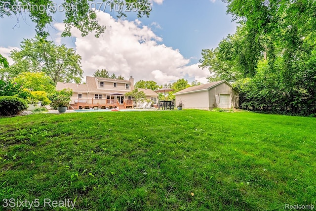 4375 Island Park Dr, Waterford, MI 48329 - view of grassy yard featuring a wooden deck and an outbuilding