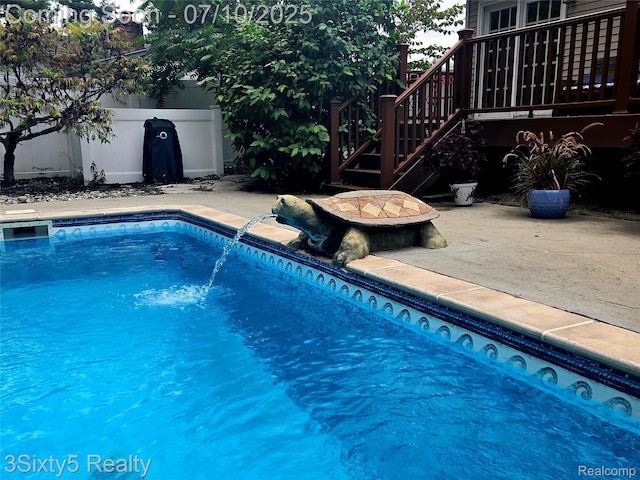 4375 Island Park Dr, Waterford, MI 48329 - swimming pool with a patio area
