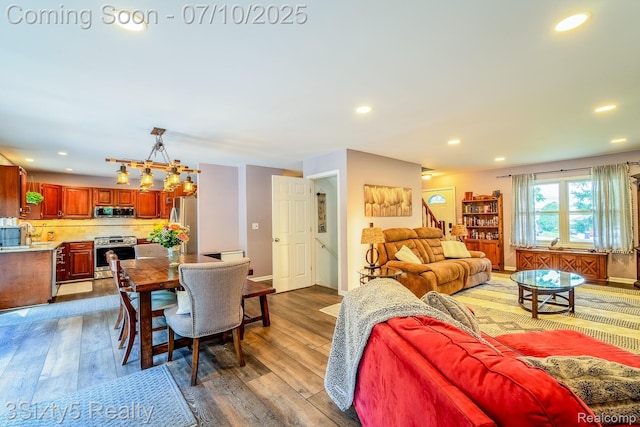 4375 Island Park Dr, Waterford, MI 48329 - living room featuring hardwood / wood-style floors and recessed lighting