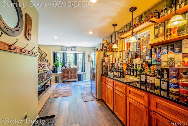 4375 Island Park Dr, Waterford, MI 48329 - indoor dry bar featuring dark wood-type flooring, hanging light fixtures, and recessed lighting