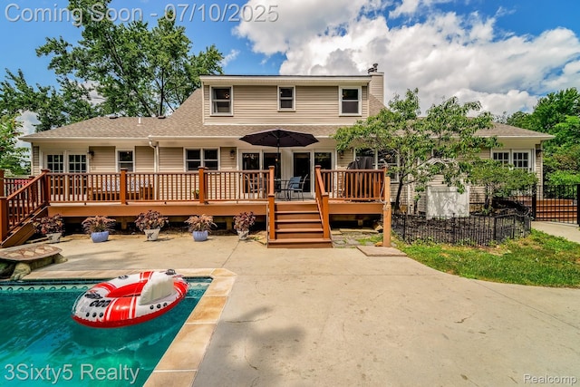 4375 Island Park Dr, Waterford, MI 48329 - view of front facade featuring a deck, an outdoor pool, a patio, a chimney, and a shingled roof