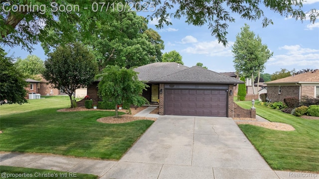 14125 Bangor Dr, Sterling Heights, MI 48313 - view of front facade featuring brick siding, a front yard, driveway, and an attached garage