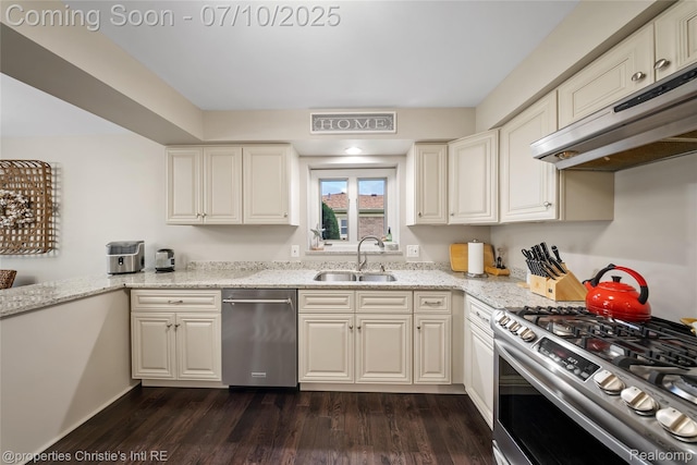 14125 Bangor Dr, Sterling Heights, MI 48313 - kitchen with stainless steel appliances, under cabinet range hood, dark wood finished floors, and light stone counters