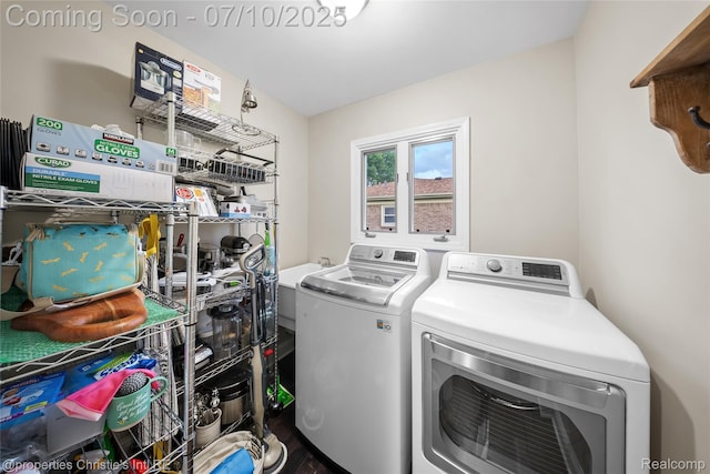 14125 Bangor Dr, Sterling Heights, MI 48313 - laundry area with washing machine and clothes dryer and wood finished floors
