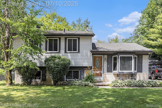 41173 Cimarron St, Clinton Township, MI 48038 - split level home with a front lawn and brick siding