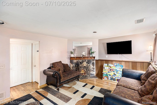 41173 Cimarron St, Clinton Township, MI 48038 - living area with wood finished floors, wood walls, and wainscoting