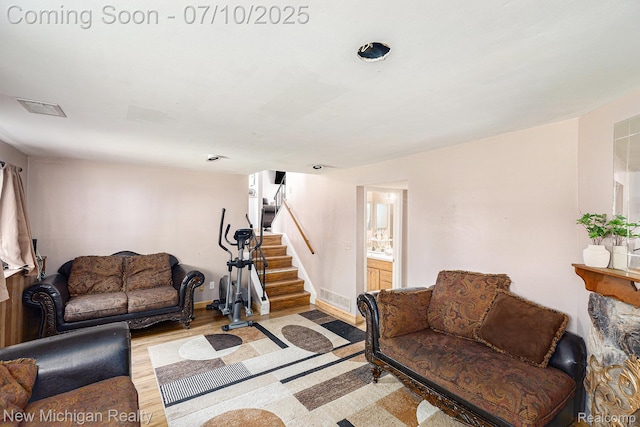 41173 Cimarron St, Clinton Township, MI 48038 - living room with stairs and wood finished floors
