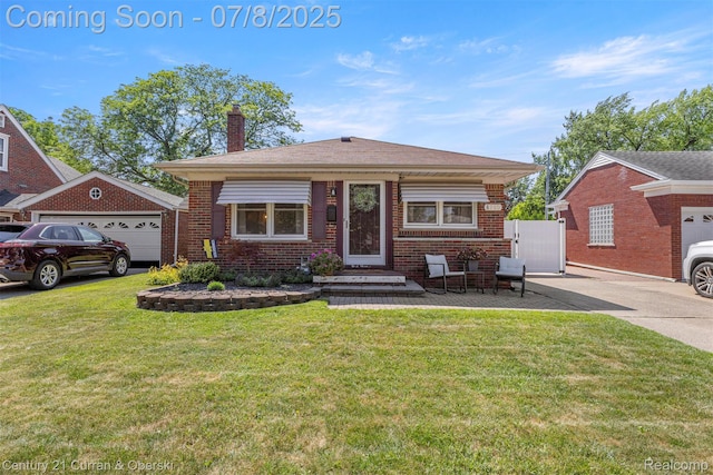 8960 Niver Ave, Allen Park, MI 48101 - view of front facade featuring a chimney, a front yard, and brick siding