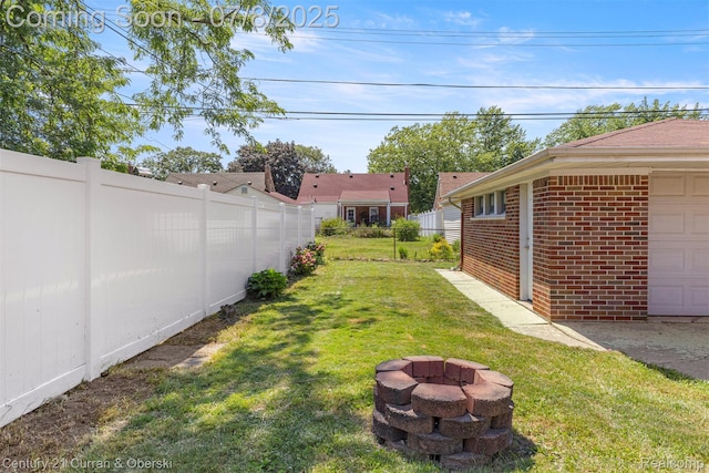 8960 Niver Ave, Allen Park, MI 48101 - view of yard with an outdoor fire pit and a garage