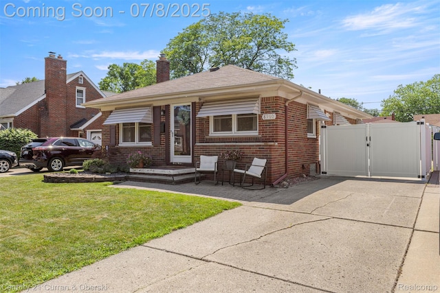 8960 Niver Ave, Allen Park, MI 48101 - view of front of home featuring brick siding and a gate