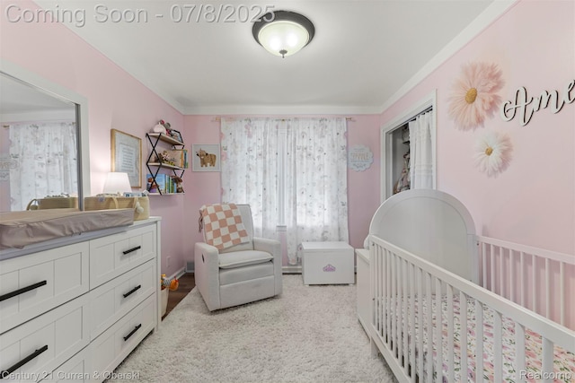 8960 Niver Ave, Allen Park, MI 48101 - bedroom featuring a nursery area, ornamental molding, and light colored carpet