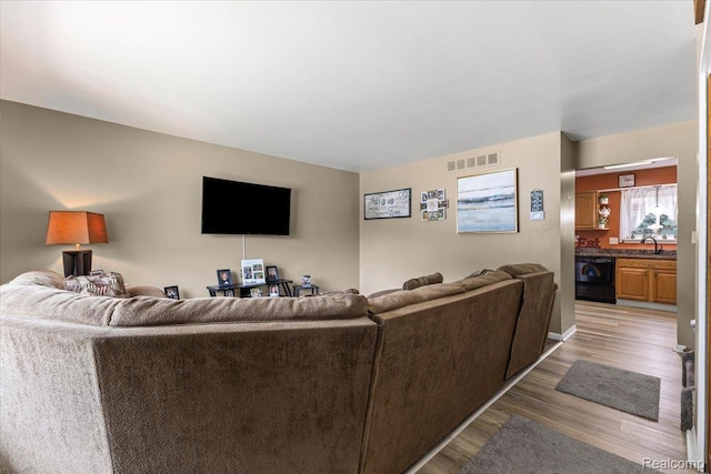 22031 Birch St, Woodhaven, MI 48183 - living room featuring light wood-style flooring