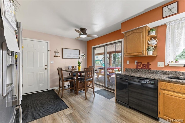 22031 Birch St, Woodhaven, MI 48183 - kitchen featuring black dishwasher, a ceiling fan, light wood-style flooring, fridge, and brown cabinetry