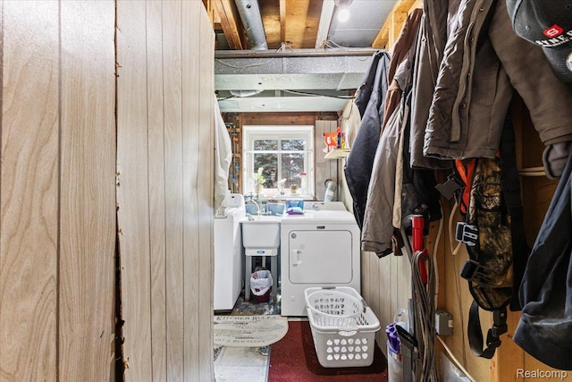 22031 Birch St, Woodhaven, MI 48183 - laundry room featuring independent washer and dryer and wooden walls