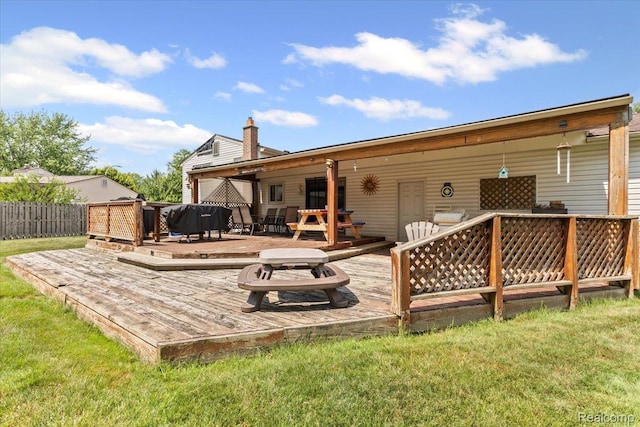 22031 Birch St, Woodhaven, MI 48183 - back of house featuring a wooden deck and a chimney