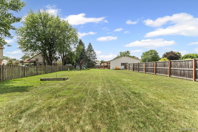 22031 Birch St, Woodhaven, MI 48183 - fenced backyard featuring a playground