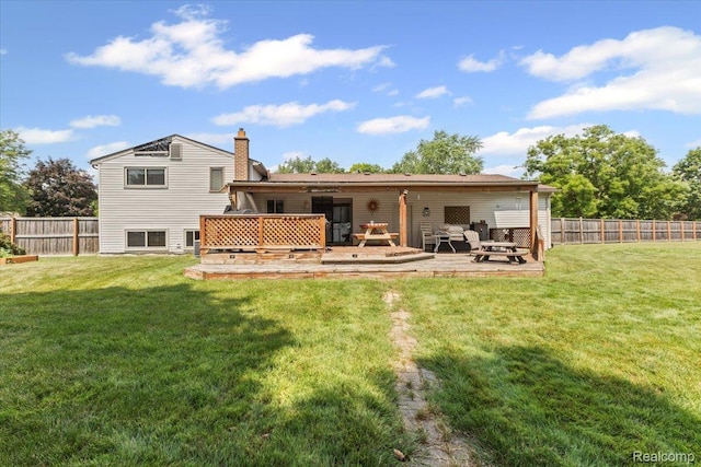 22031 Birch St, Woodhaven, MI 48183 - rear view of property featuring a wooden deck and a chimney