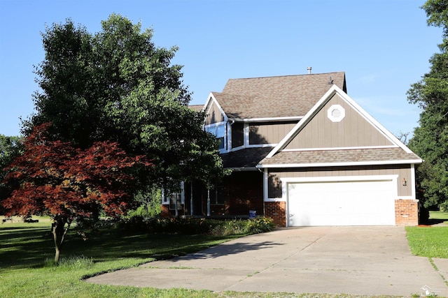 13578 Strasburg Rd, La Salle, MI 48145 - view of front of home featuring brick siding, a front yard, concrete driveway, a shingled roof, and an attached garage