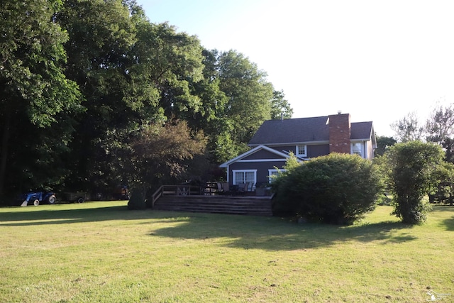 13578 Strasburg Rd, La Salle, MI 48145 - view of grassy yard with a wooden deck