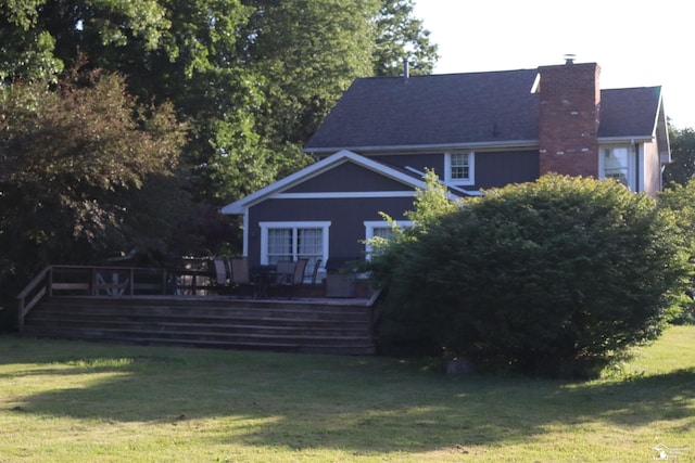 13578 Strasburg Rd, La Salle, MI 48145 - back of property featuring a chimney, a wooden deck, and a yard