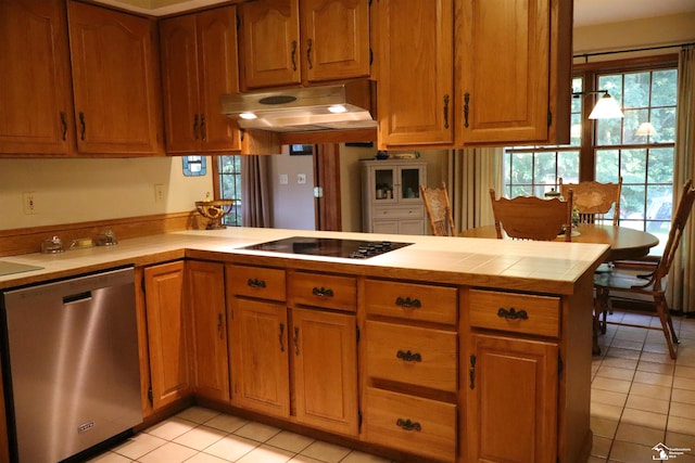 13578 Strasburg Rd, La Salle, MI 48145 - kitchen featuring dishwasher, under cabinet range hood, light tile patterned flooring, black electric cooktop, and a peninsula