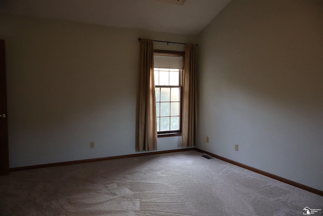 13578 Strasburg Rd, La Salle, MI 48145 - empty room with carpet and lofted ceiling