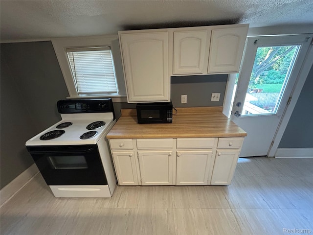 7 E Noble Ave, Monroe, MI 48162 - kitchen with range with electric stovetop, black microwave, a textured ceiling, white cabinetry, and light countertops