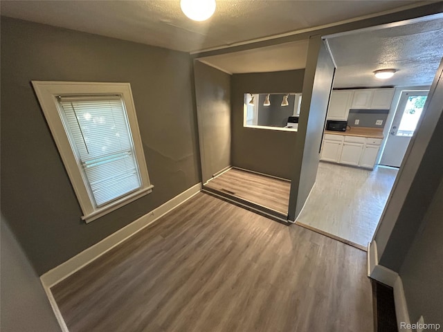 7 E Noble Ave, Monroe, MI 48162 - spare room featuring light wood-style flooring and baseboards