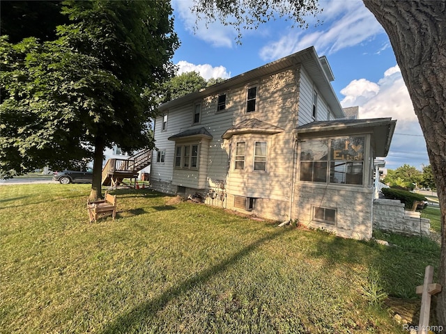 7 E Noble Ave, Monroe, MI 48162 - back of house featuring a yard and stairway