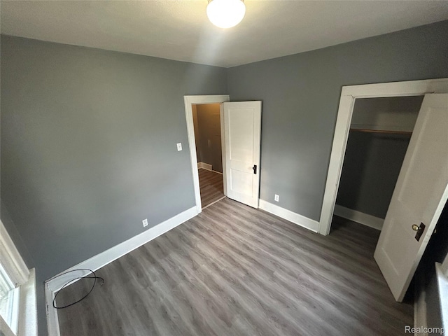 7 E Noble Ave, Monroe, MI 48162 - unfurnished bedroom featuring wood finished floors and a closet